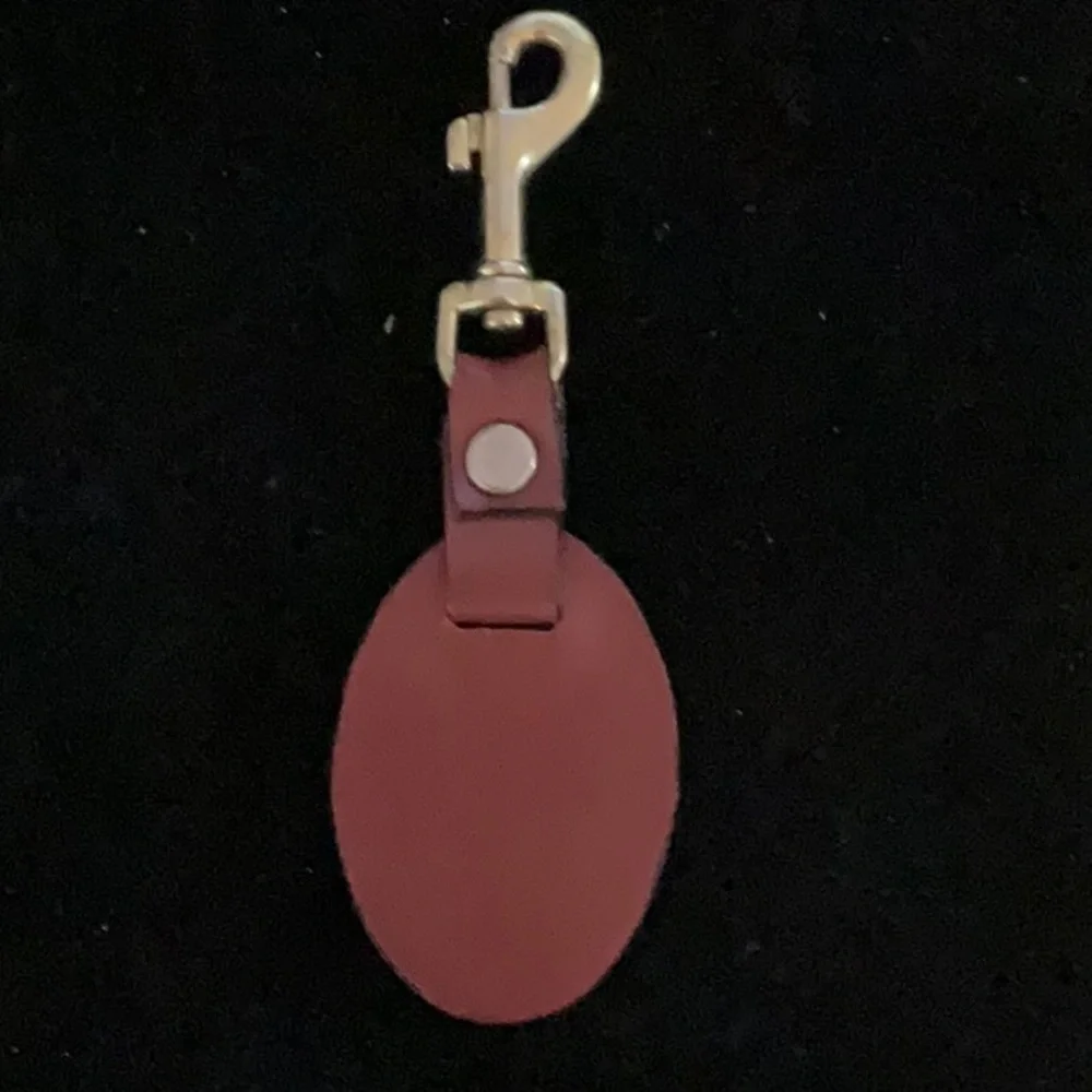 Cartier Elegant Red Leather Keychain with Gold Hardware